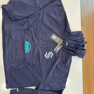 NHL Seattle Kraken Deep Sea Blue 1/2 zip cropped wind jacket.